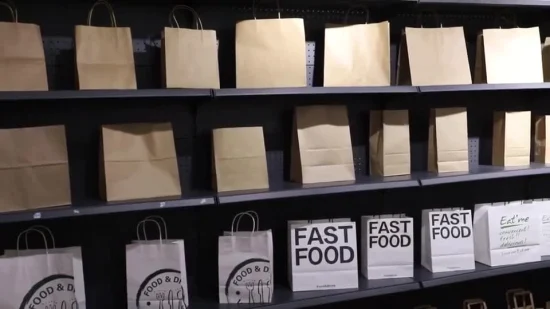 Großhandel Einkaufs-Geschenk-Kleidung recycelte braune Kraftpapiertüten mit gedrehtem Papiergriff
